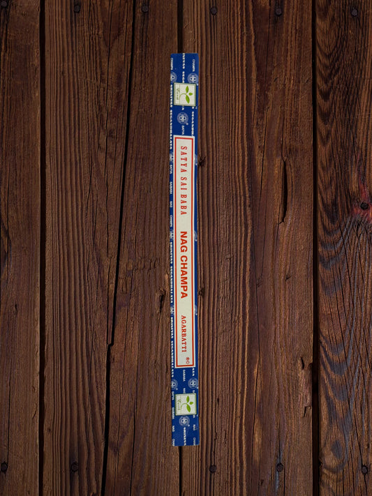 Single Satya Sai Baba Nag Champa 10g incense package on a white brick background