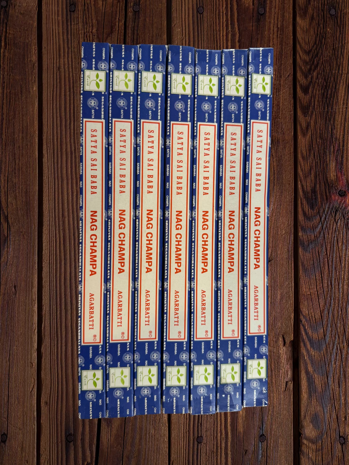 Seven Satya Sai Baba Nag Champa 10g incense packages arranged side by side