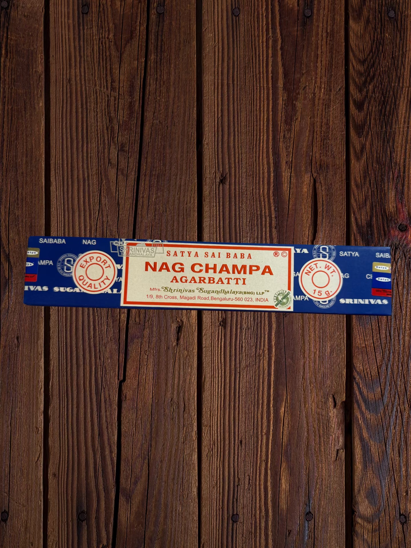 Single Satya Sai Baba Nag Champa 15g incense package on a wooden background”