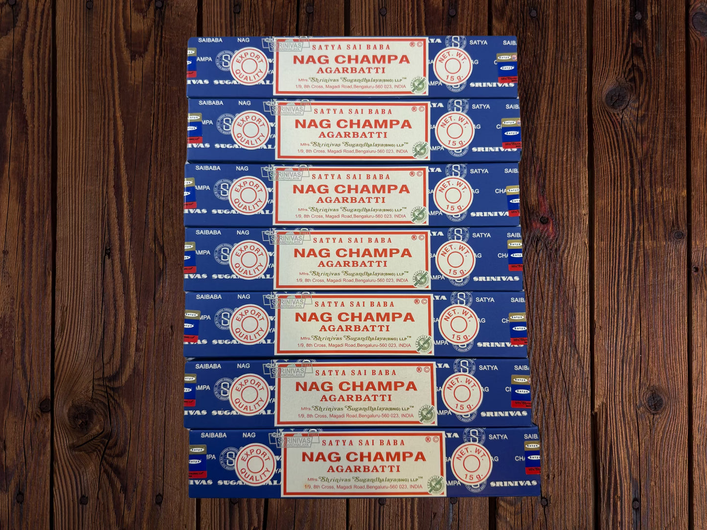 Seven Satya Sai Baba Nag Champa incense packages arranged side by side