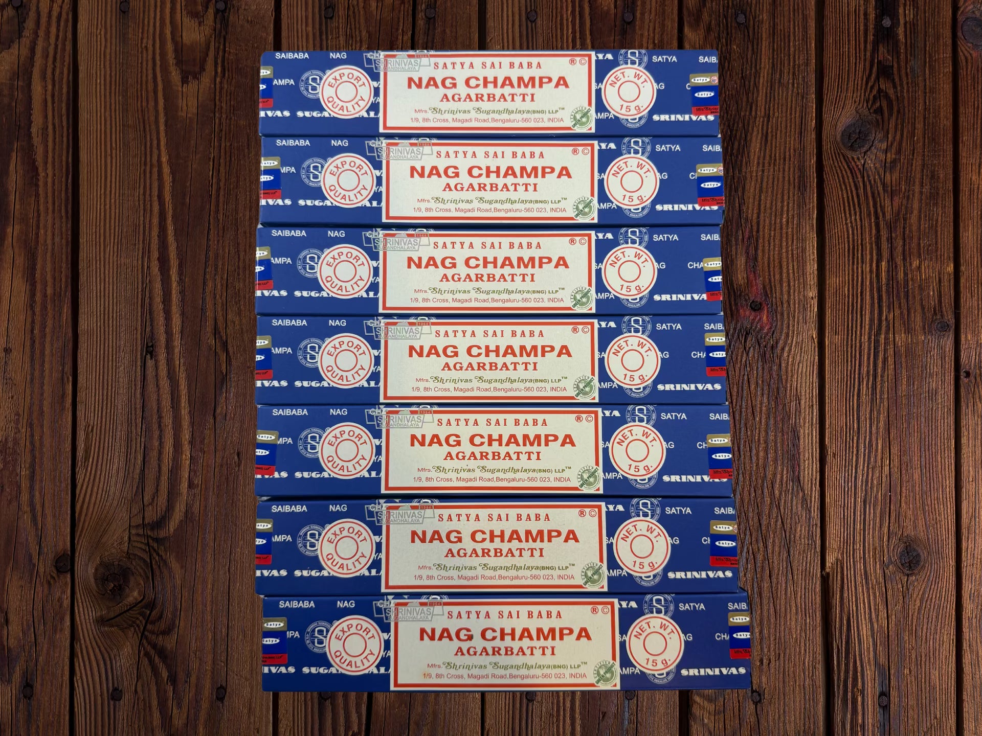 Seven Satya Sai Baba Nag Champa incense packages arranged side by side