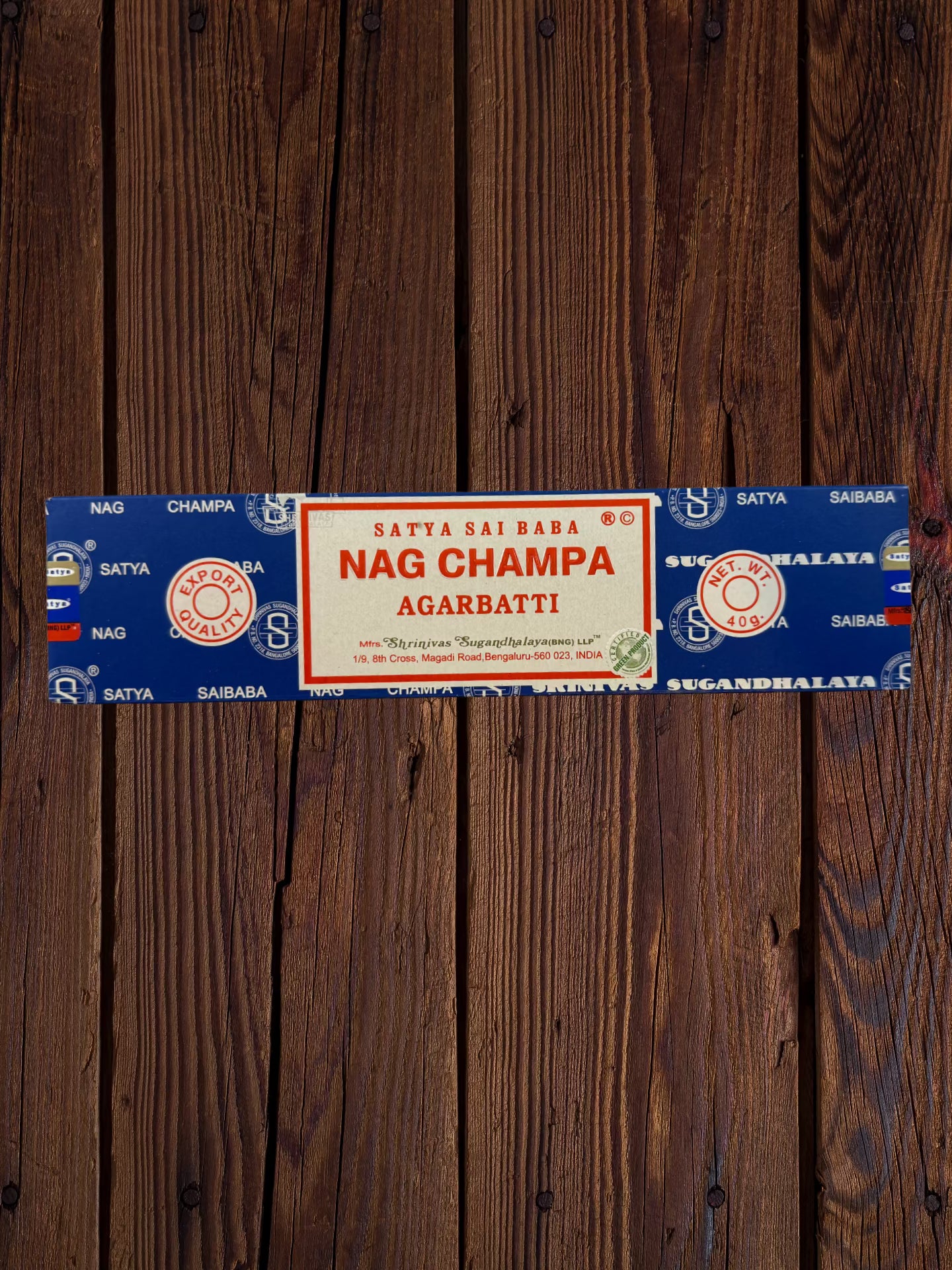 Single Satya Sai Baba Nag Champa 40g incense package on a wooden background