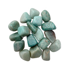 Amazonite tumble stones displayed in a small pile – polished crystals for meditation and Reiki