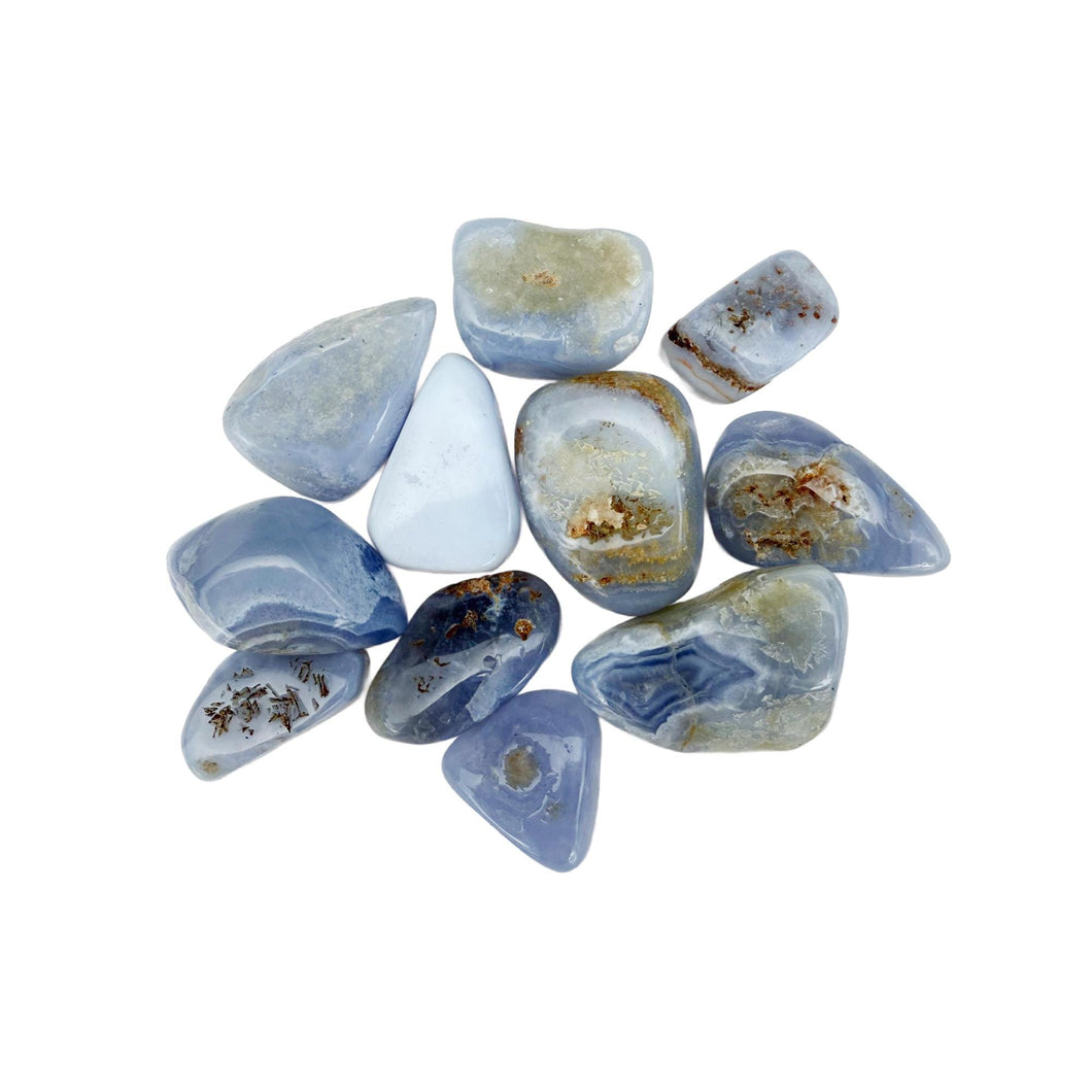 Polished Blue Lace Agate tumble stones on a white background – calming crystal for peace and communication