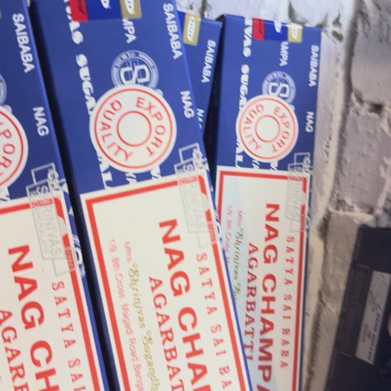 Open display box of Satya Sai Baba Nag Champa incense beside a closed box and single package